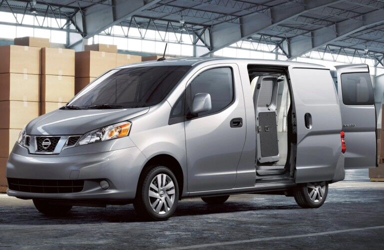 Front driver angle of a grey 2020 Nissan NV200 Compact Cargo with its doors open