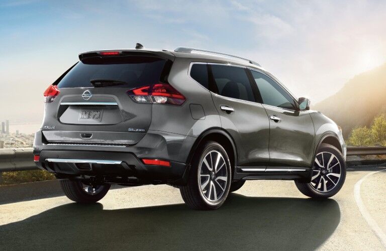 Rear passenger angle of a grey 2020 Nissan Rogue