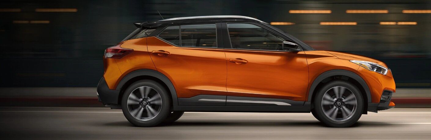 Passenger angle of an orange 2020 Nissan Kicks