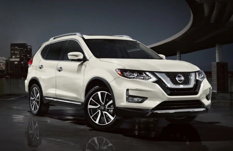 Front passenger angle of a white 2020 Nissan Rogue
