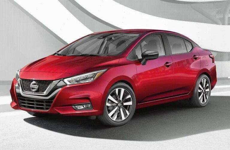 Front driver angle of a red 2020 Nissan Versa sedan