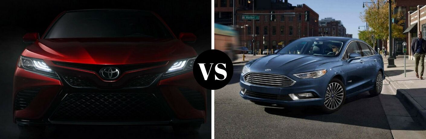 Left side a red 2018 Toyota Camry in the dark, on the right a blue 2018 Ford Fusion parked