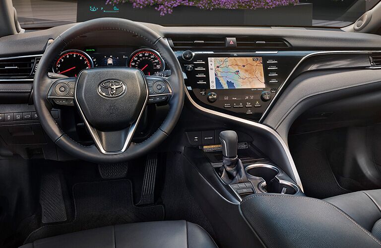 Dashboard and dark grey front seats in 2019 Toyota Camry