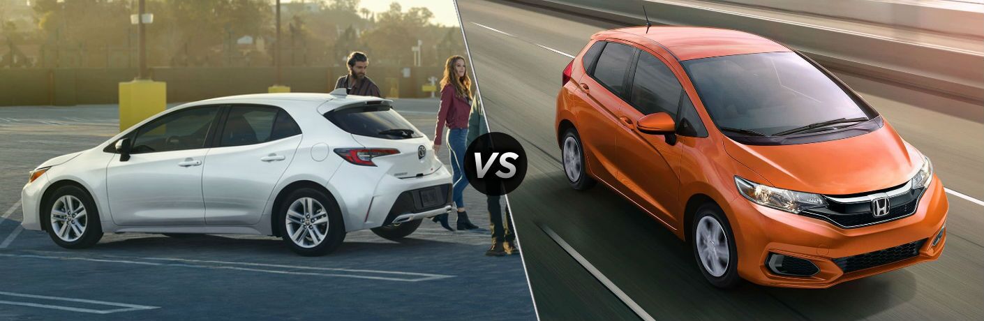 white 2019 Toyota Corolla Hatchback set against orange 2019 Honda Fit