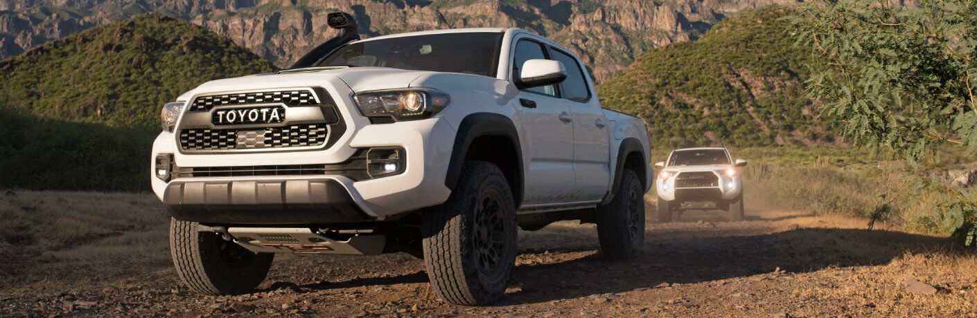 front view of white 2018 Toyota Tacoma TRD Pro travelling off road