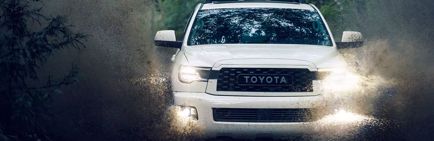 White 2020 Toyota Sequoia TRD Pro driving in rainy weather