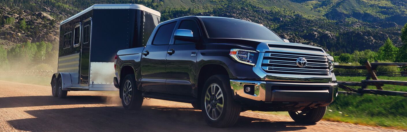 Black 2020 Toyota Tundra towing a trailer