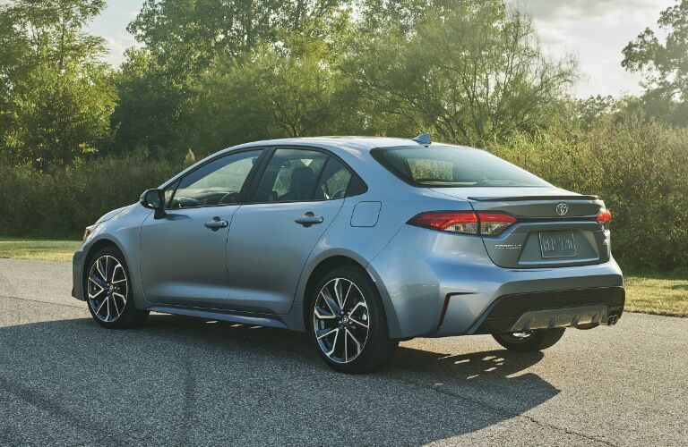 Blue-grey 2020 Toyota Corolla parked near a forest