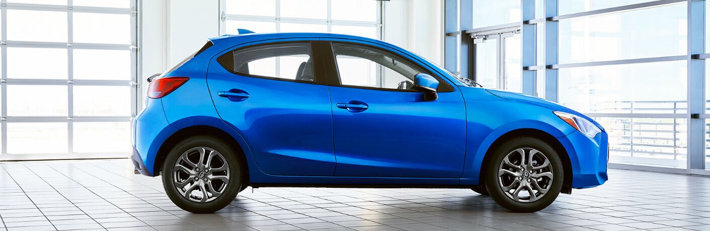 Side view of blue 2020 Toyota Yaris Hatchback
