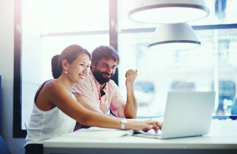 couple researching online car shopping resources