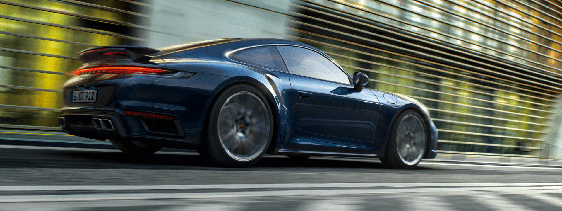 A Porsche driving fast down a street