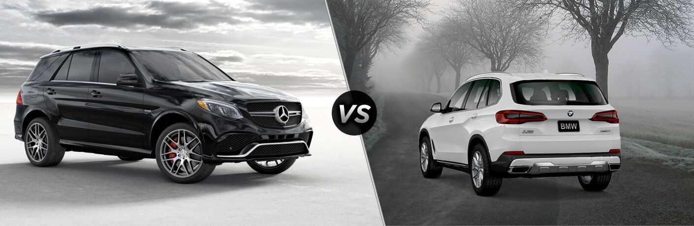 2019 MB AMG GLE exterior front fascia and passenger side vs 2019 BMW X5 exterior back fascia and drivers side on foggy road