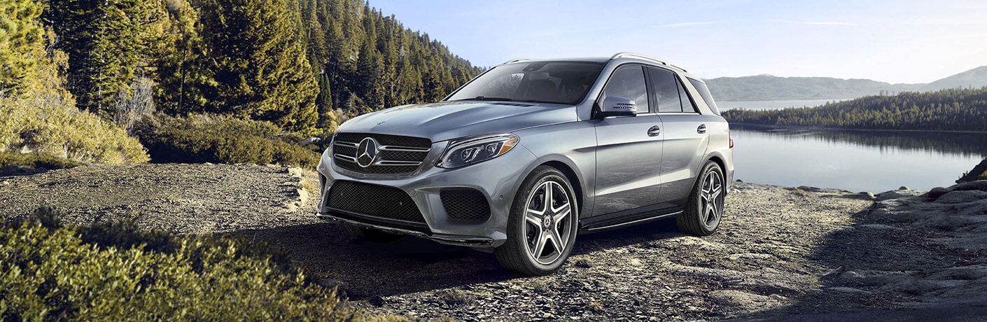 2019 MB AMG GLE exterior front fasicia and drivers side parked on gravel road with pine trees
