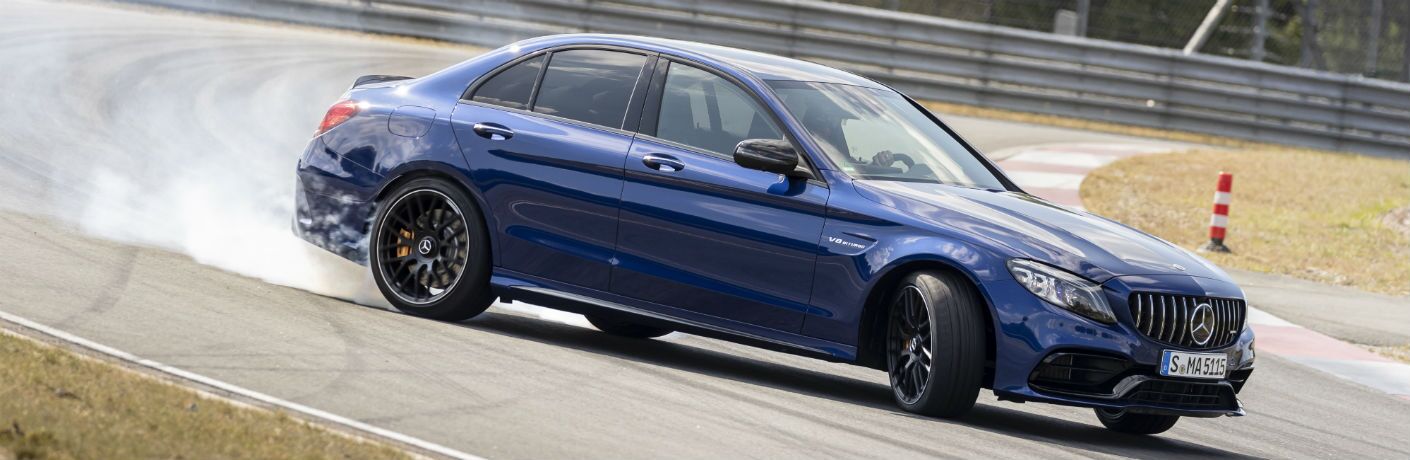 2019 MB AMG C 63 exterior front fascia and passenger side on racetrack