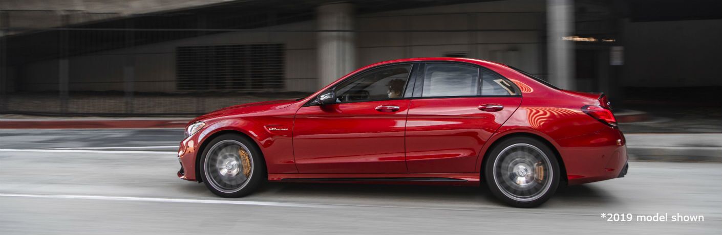 2020 MB C-Class exterior driver side profile going fast on blurred highway