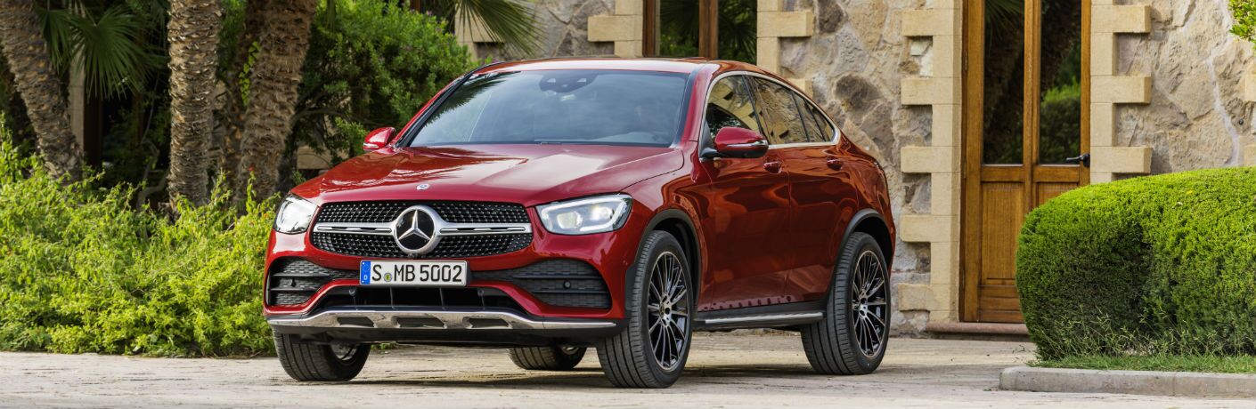 2020 MB GLC Coupe exterior front fascia and drivers side in front of stone house_o