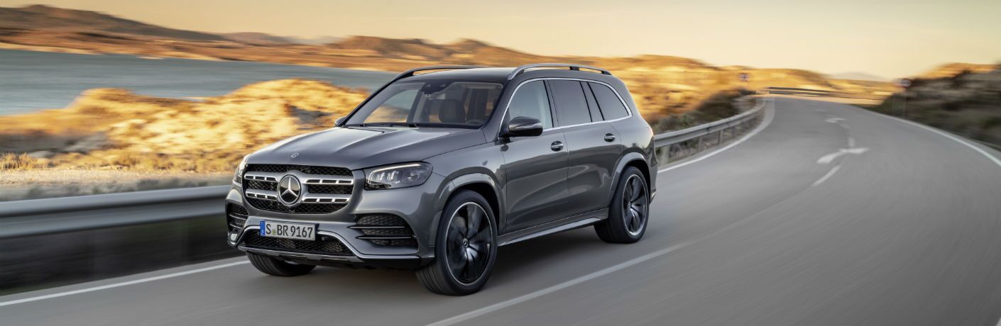 2020 MB GLS SUV exterior front fascia and driver side going fast on highway with blurred surroundings