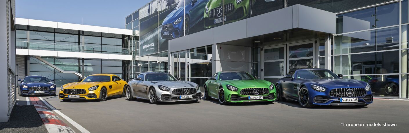 2020 MB GT Coupe lineup exteriors front fascia in front of dealership with large windowed exterior