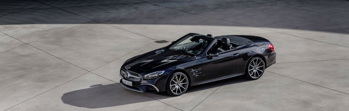 2020 MB SL Grand Edition exterior front fascia and drivers side parked in concrete stadium