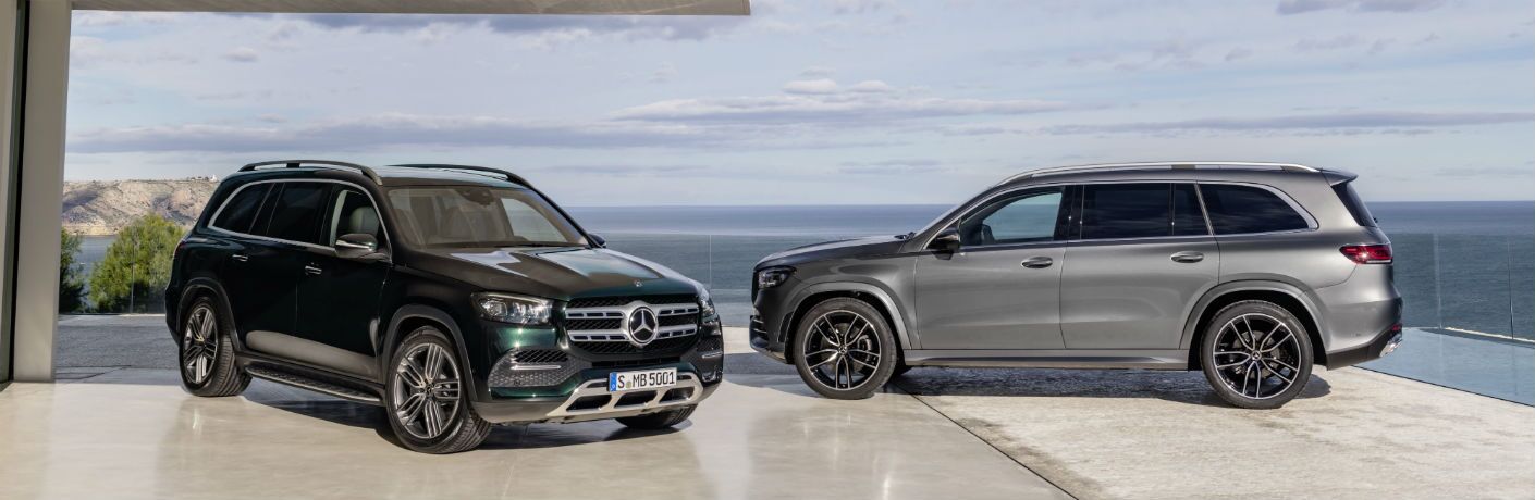 2020 MB GLS exterior front fascia and passenger side and GLS exterior driver side profile next to house overlooking ocean