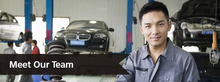 An image of a mechanic in a shop with the text that says "meet our team"