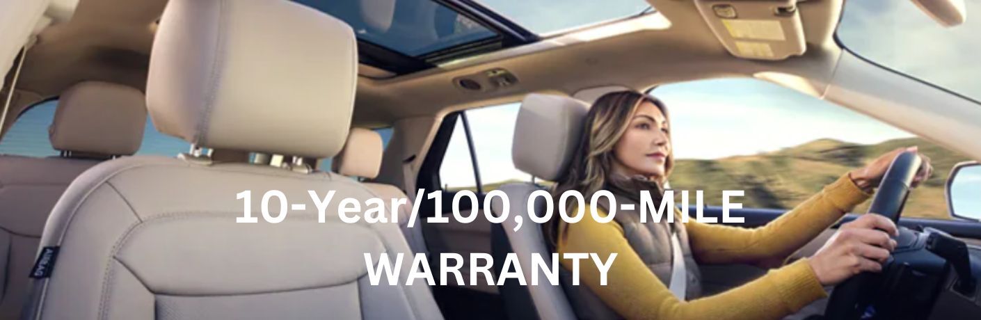 a woman driving a Ford vehicle