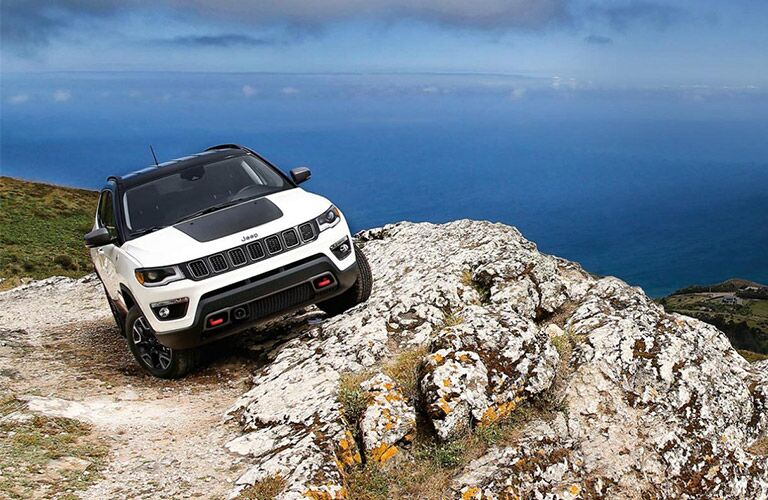 2020 Jeep Compass driving over rocks