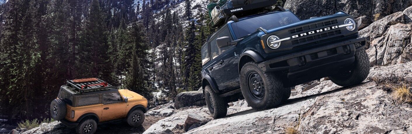 2021 Ford Bronco trim levels on steep rocky cliff