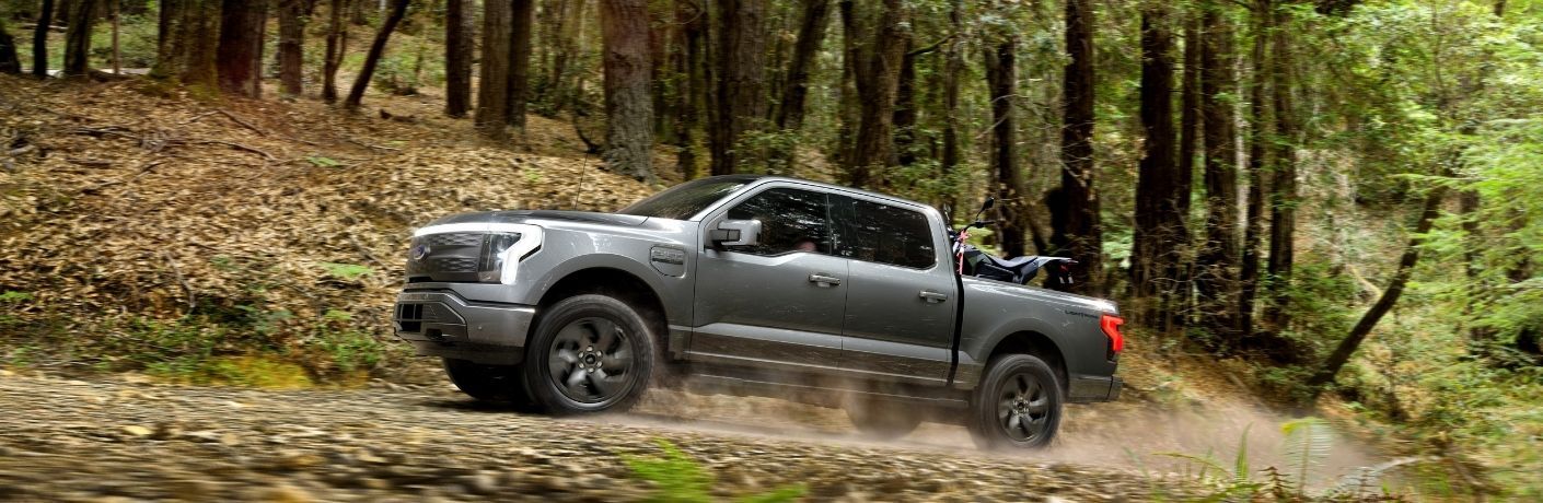 2022 Ford F-150 Lightning on a forest road