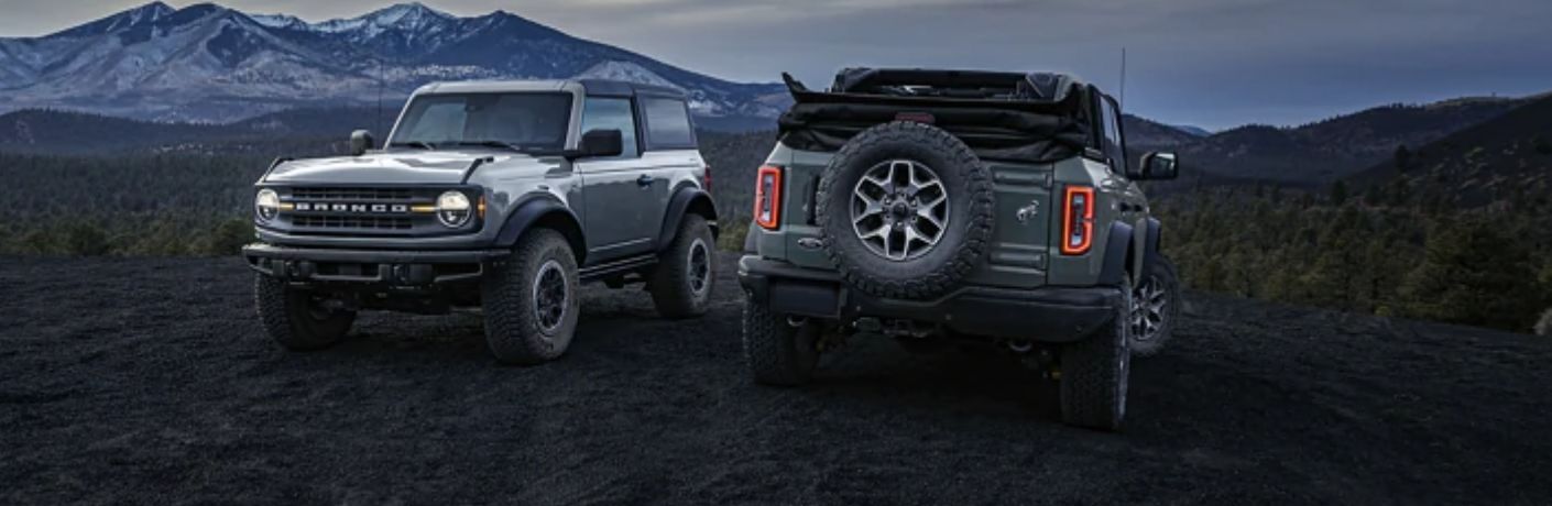 front and rear view of two parallely parked 2023 Ford Bronco® SUVs