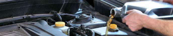 mechanic changing oil