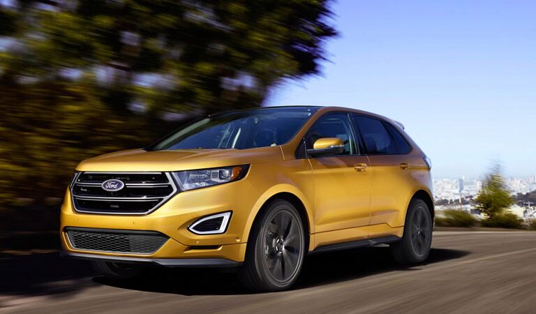 yellow ford edge on the road