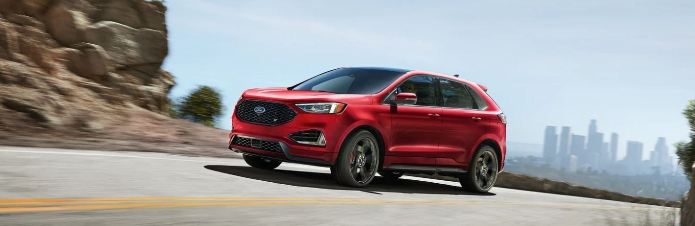 Used Ford Edge Red driving on the road
