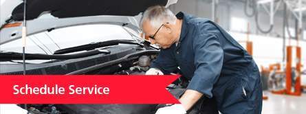 man working on car schedule service link