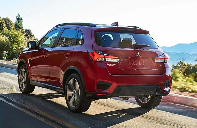 2020 Mitsubishi RVR red driving away from shot on mountain road