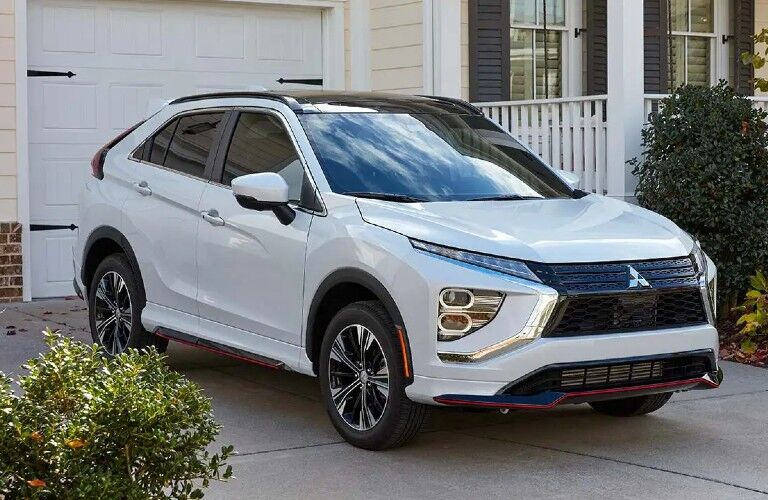 2022 Mitsubishi Eclipse Cross white parked in front of garage