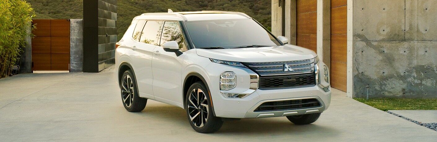 2022 Mitsubishi Outlander white parked in back yard