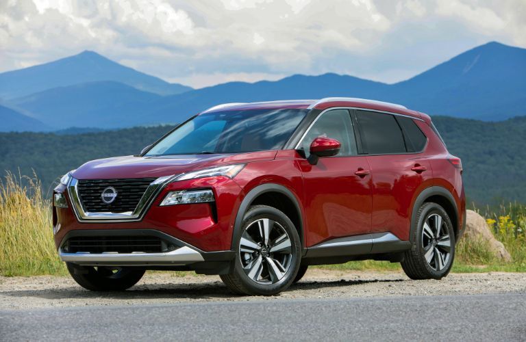 2023 Nissan Rogue® Red parked on the side of the road