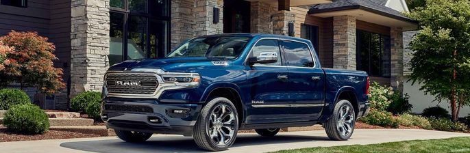2023 RAM 1500 parked in front of a house