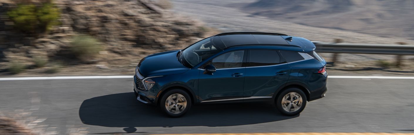 2024 Kia Sportage Hybrid side view on the road