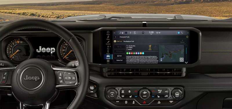 The sophisticated infotainment system with off-road mapping features in the 2025 Jeep Wrangler 4xe