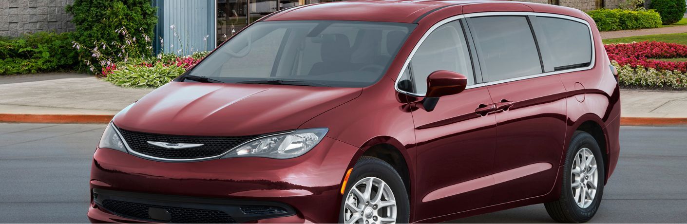 Front-quarter view of the 2023 Chrysler Voyager Red