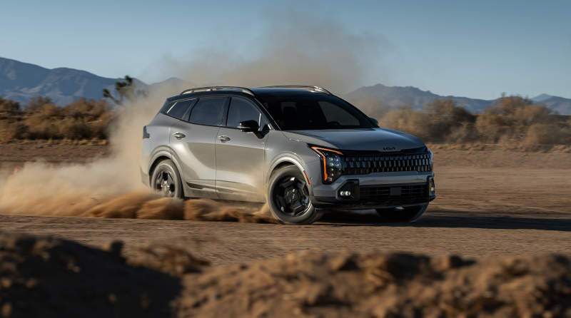 A front 3/4 external view of the 2026 Kia Sportage off-roading