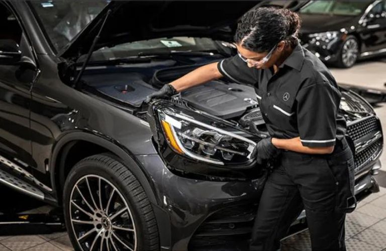 Mercedes-Benz service technician working on a car