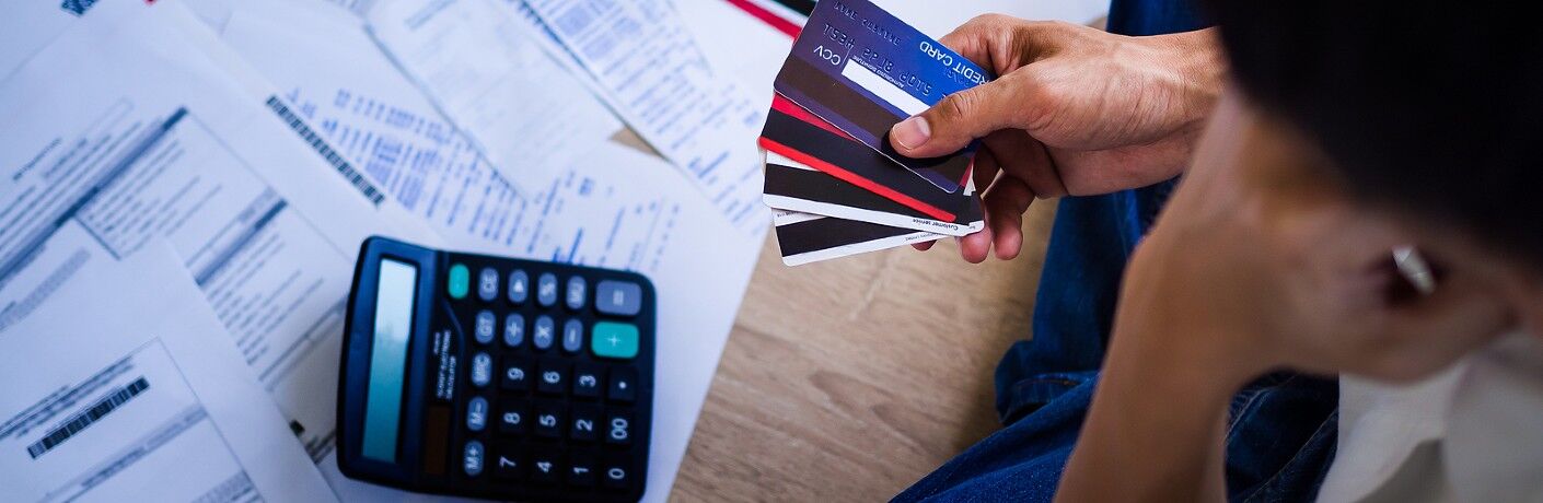Person looking at their finances and credit cards