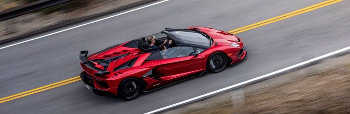 Pre-Owned Aventador SVJ Red driving on the road
