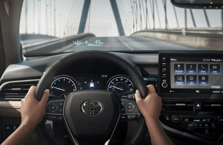An image of a steering wheel on the dashboard system of the 2022 Toyota Camry