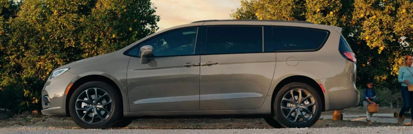 Side view of the 2023 Chrysler Pacifica Brown parked