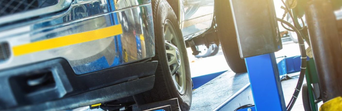 An image of a wheel alignment equipment during car service.