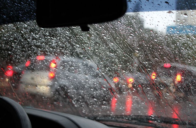 windshield with pattering rain in a car
